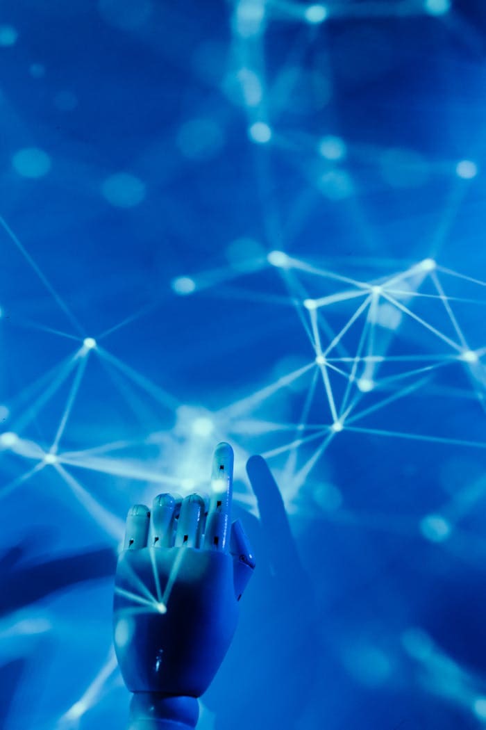 An AI hand interacts with a digital network of interconnected nodes and lines.